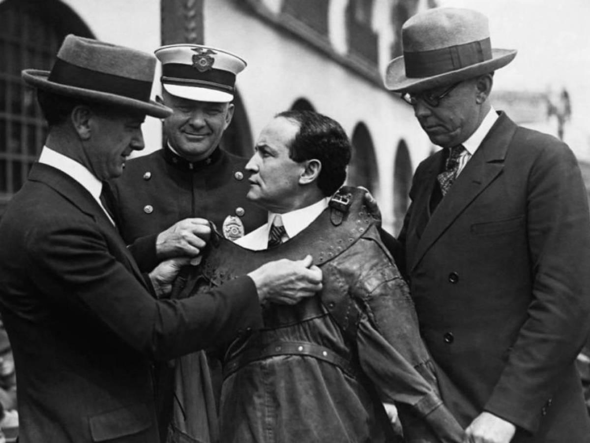 Old photo of Harry Houdini and his trick "Straitjacket Escape"