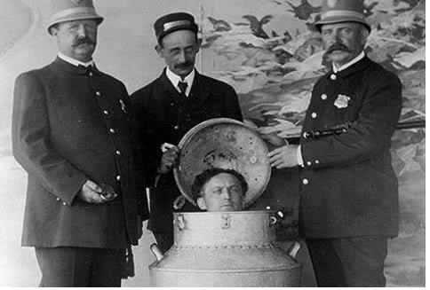 Vintage photo of Harry Houdini illusion, called "The Milk Can Escape"