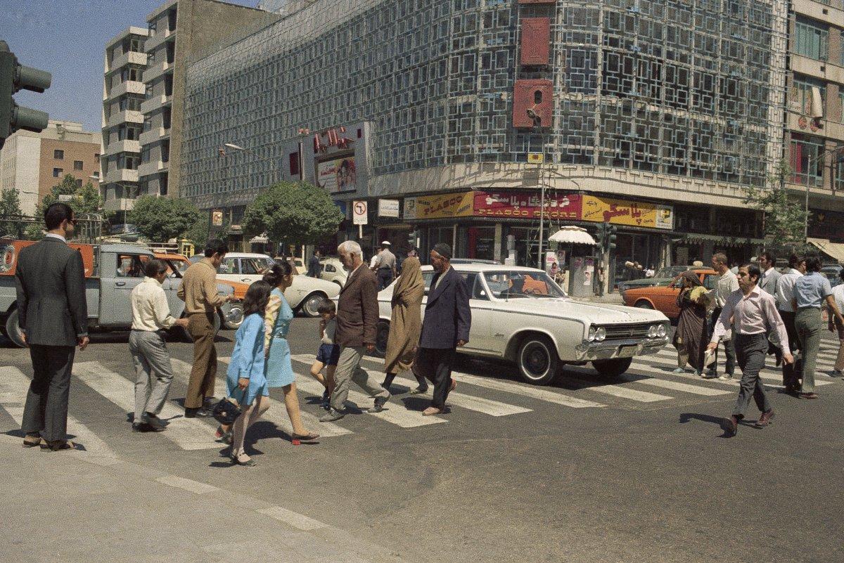 Old photo of a street scene showing pedestrians on a sidewalk, June 16, 1970, Tehran, Iran - before the Islamic revolution