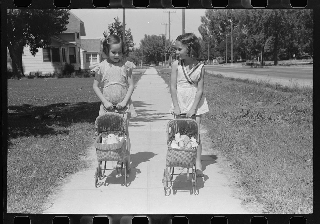 vintage photo kids with dolls and toy carts