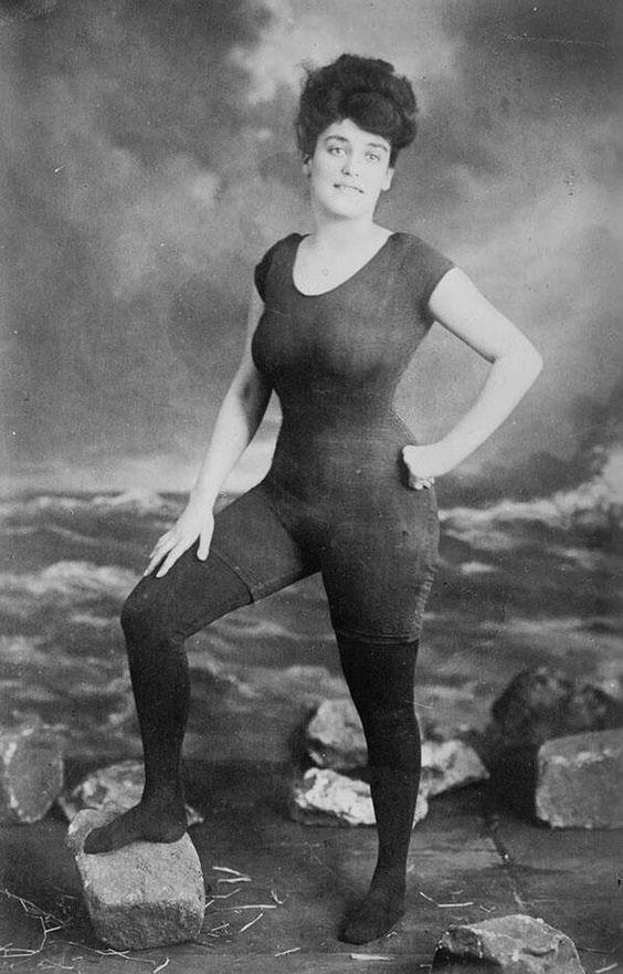 Retro photo of a girl in first fitted one-piece bathing costume, 1907. Model was arrested for indecency