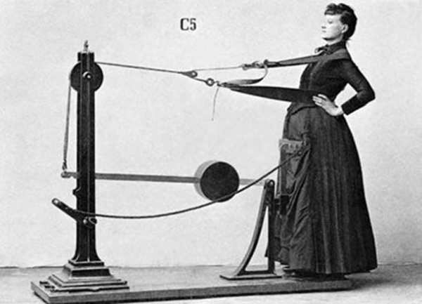 Retro photo of a woman and vintage exercise machine