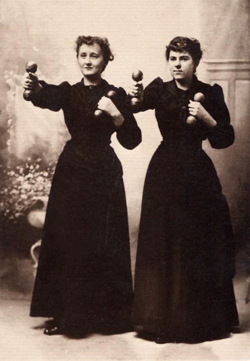 Retro photo of two women having Weight Training
