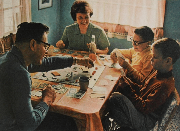 retro photo family playing Monopoly