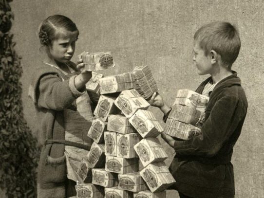 Germany, 1923. Hyperinflation. Kids are playing with money packs, because toy blocks are too expensive