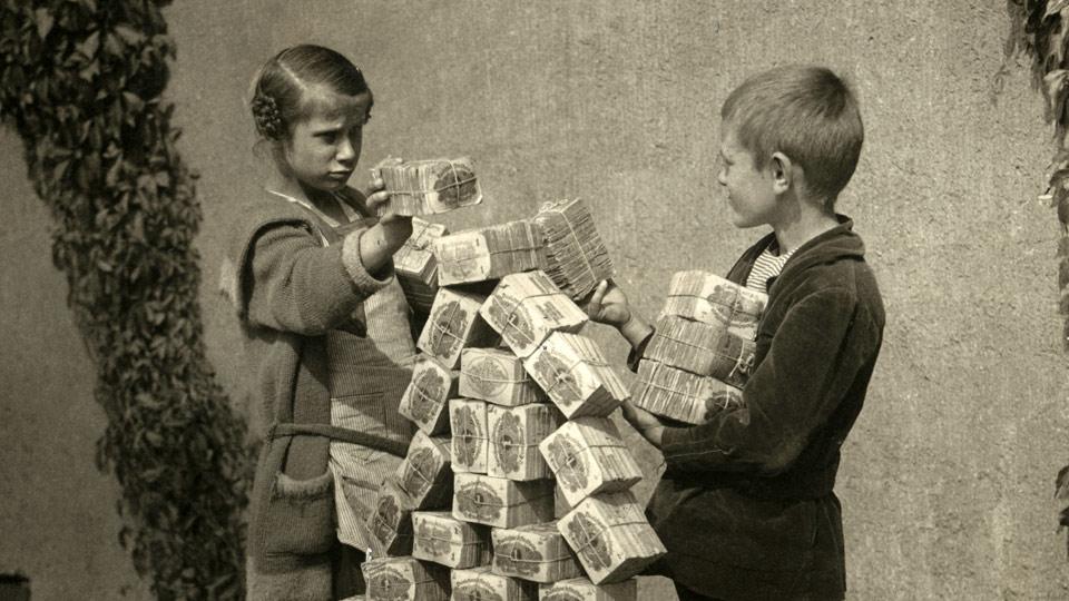 Old photo of kids playing with money packs
