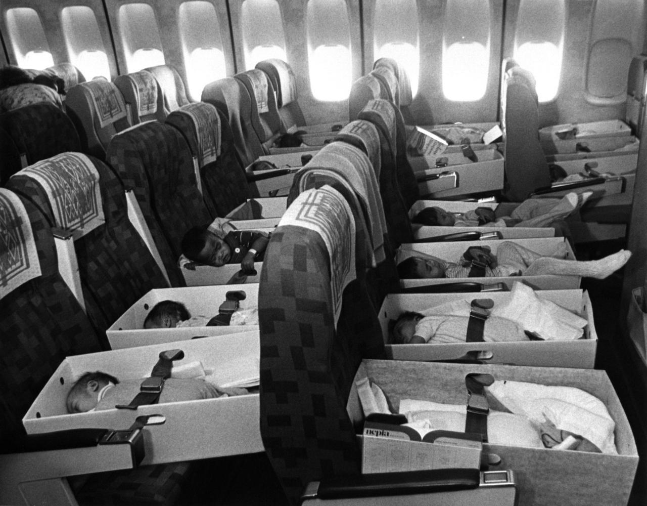  Old photo of a plane with little babies, evacuated from Vietnam