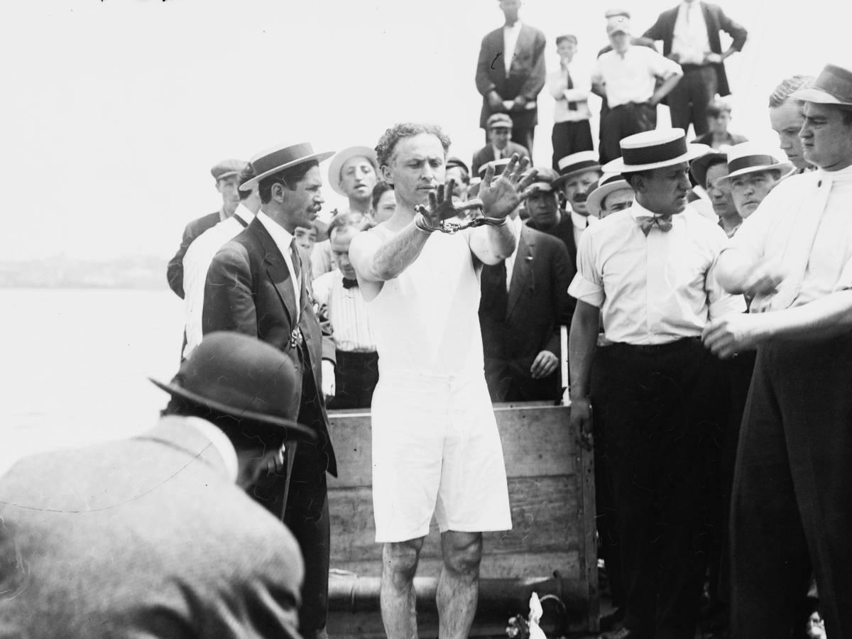 Vintage photo of Harry Houdini and his trick "Overboard Box Escape"