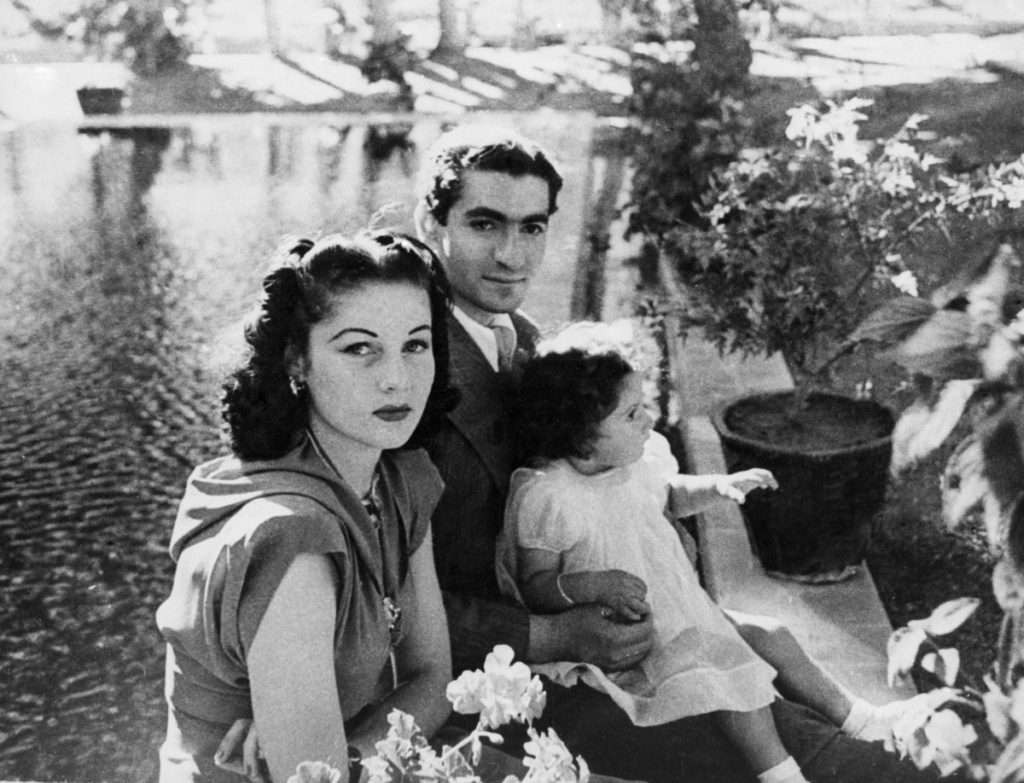 old photo of Shah Muhammed Reza Pahlevi, his wife, Queen Fawzia, and the little Princess Shahnaz