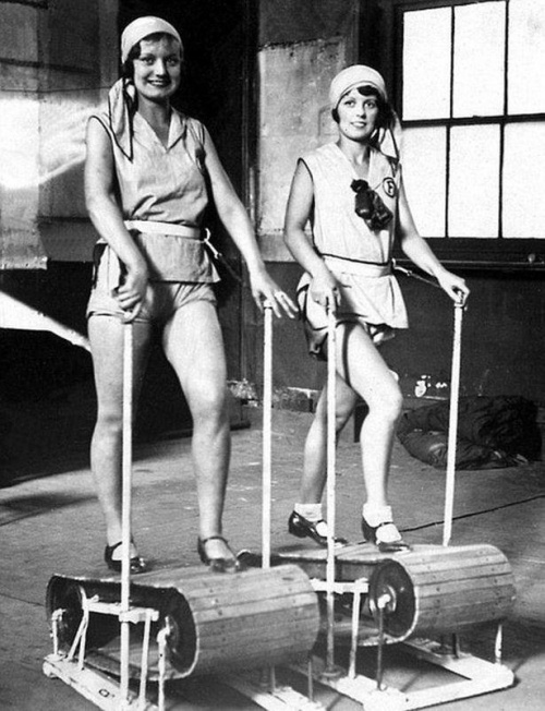 retro photo of women on wooden treadmills