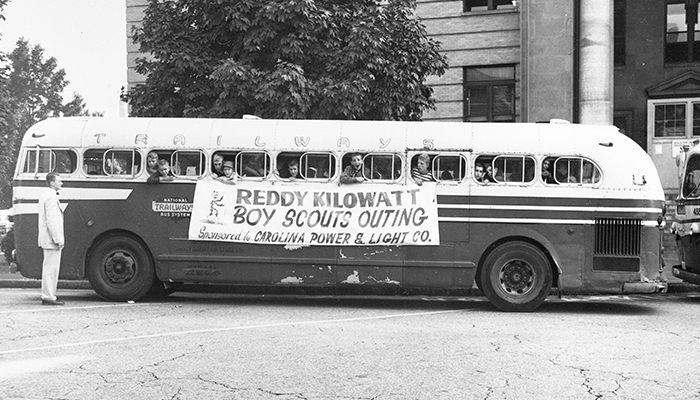 Retro photo (1950s) bus with boy scout