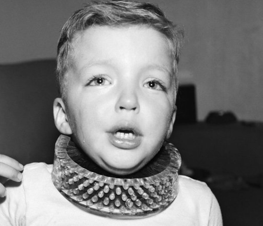 retro photo of a boy with neck brush