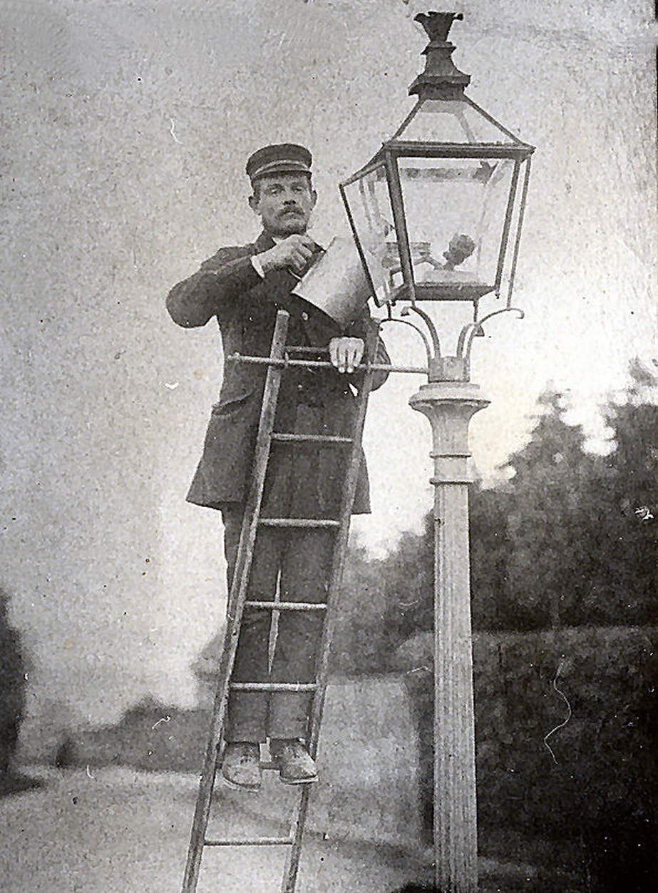 vintage photo of a lamplighter