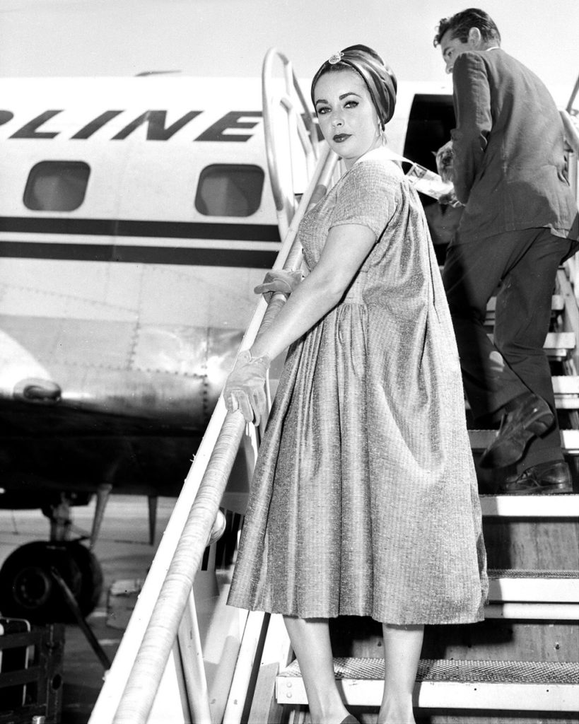 vintage celeb photos Elizabeth Taylor boards a plane  for Hollywood in 1958
