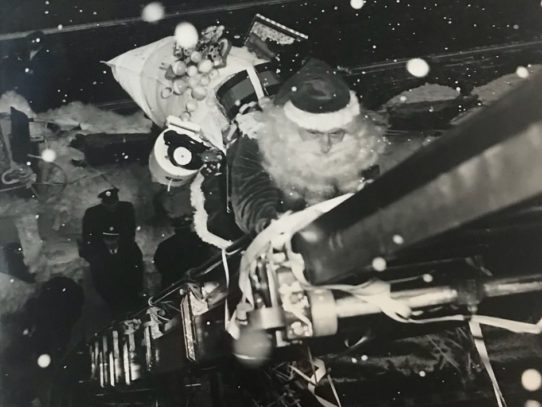 Santa climbing the ladder up to Gimbel’s Toyland, 1947