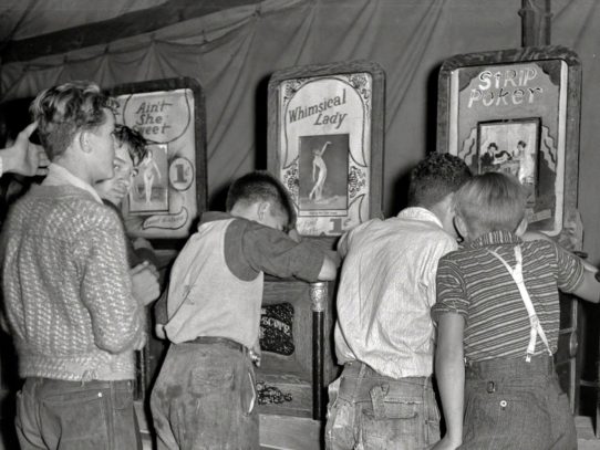 Boys looking at naked lady penny arcade machines, Granville,West Virginia, 1938