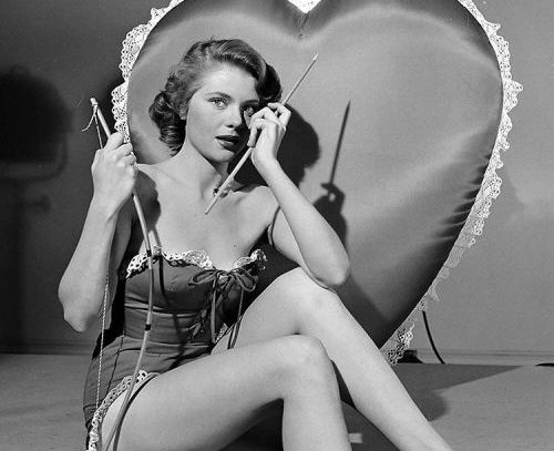 Peggie Castle dressed as Cupid, 1950