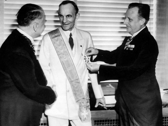 Henry Ford receiving the Grand Cross of the German Eagle from Nazi officials, 1938