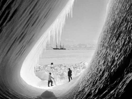 Scientists looking at Terra Nova from ice grotto in Antarctica