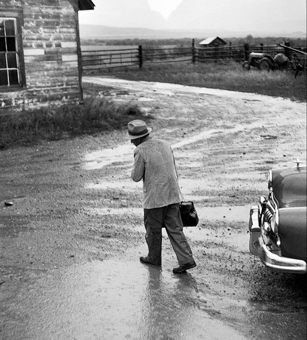 Dr. Ernest Ceriani en route to a house call under rainy conditions in Kremmling, Colorado, in 1948