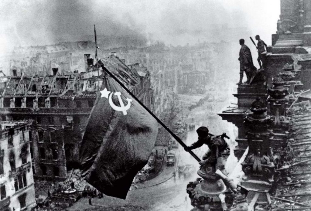 Raising a Flag over the Reichstag by Yevgeniy Khaldei,1945 - Old Pictures