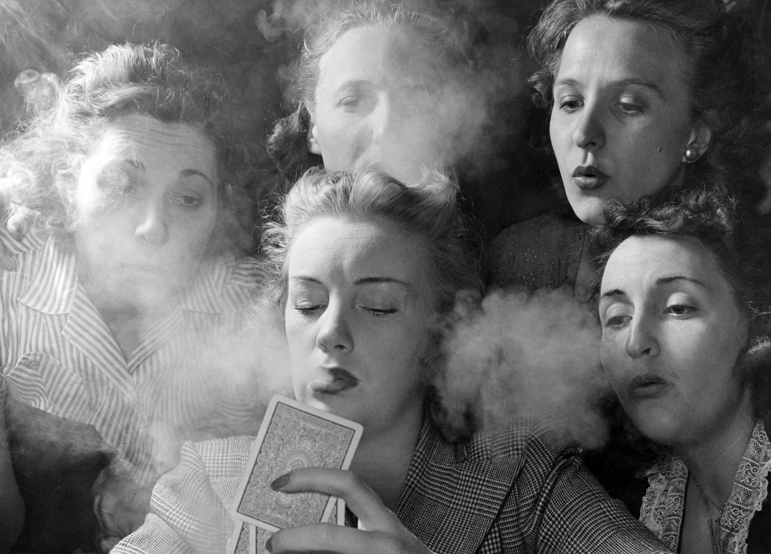 Members of the Young Women’s Republican Club of Milford, Connecticut, play poker and smoke