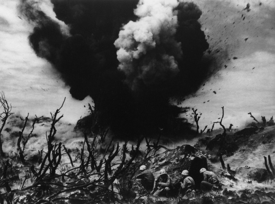The battle of Iwo Jima. The demolition team blasts the cave on the hill