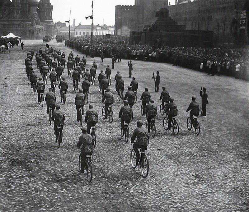 Bicycle riders during an army parade in Soviet Union