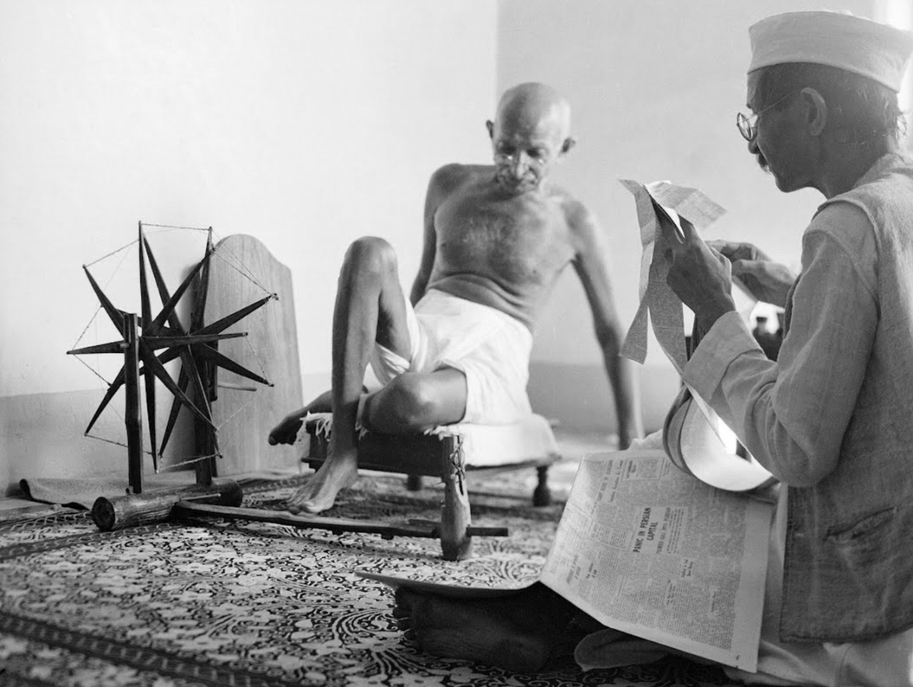 Gandhi stretching during the reading